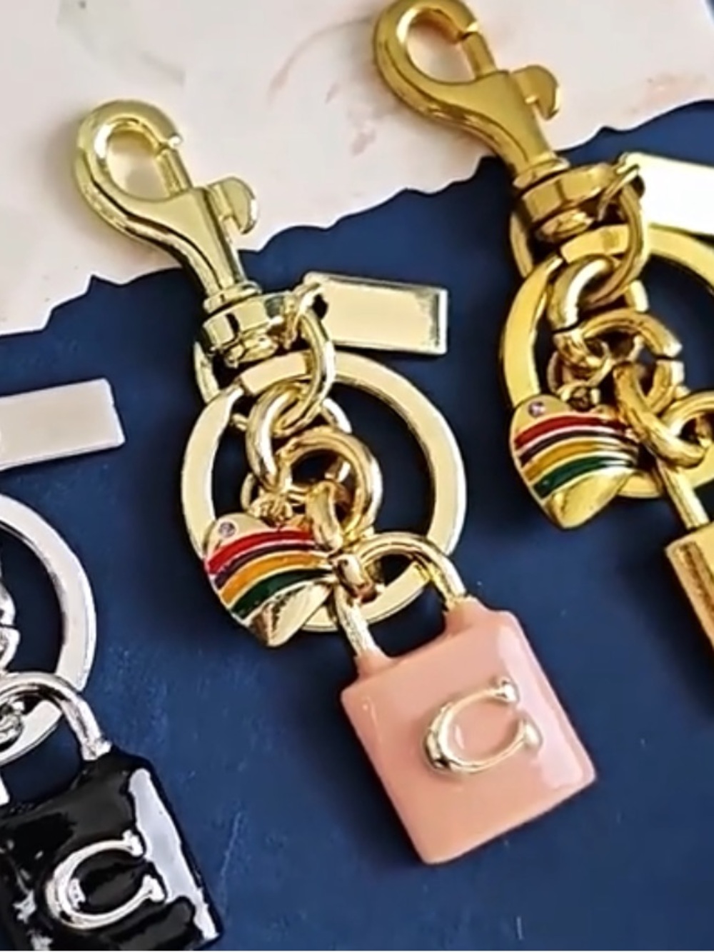 Coach Gold-Tone Keychain with Pink Charm & Multicolor Striped Heart - Picture 2 of 2